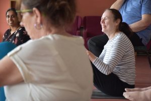 Members taking part in yoga