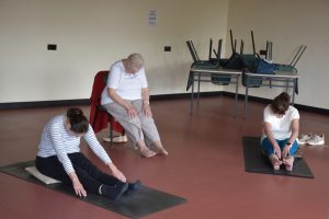 Members taking part in yoga