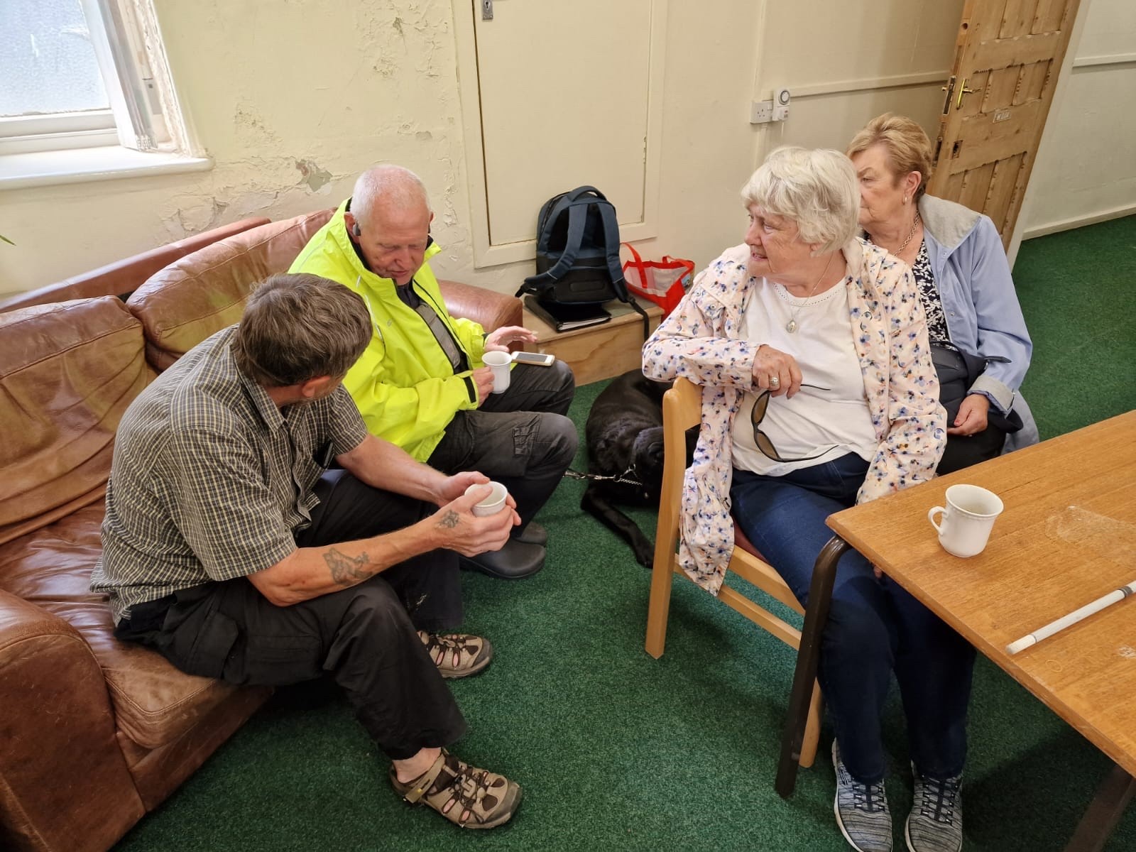 Picture showing Trustee David chatting with group members.