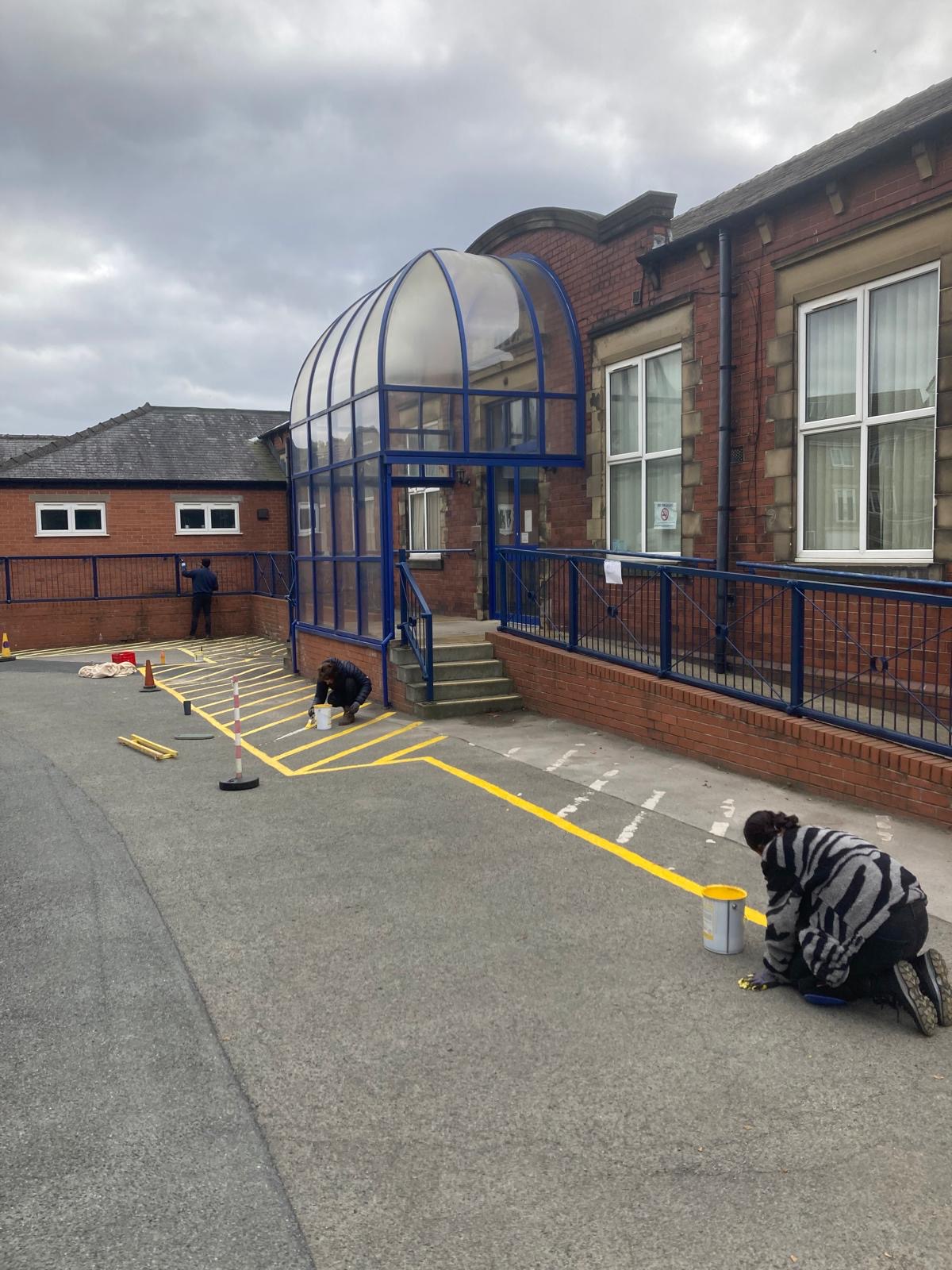 Image of the team painting the yellow lines